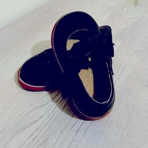 I am selling brand new black size 5 dress shoes for a toddlers girl.